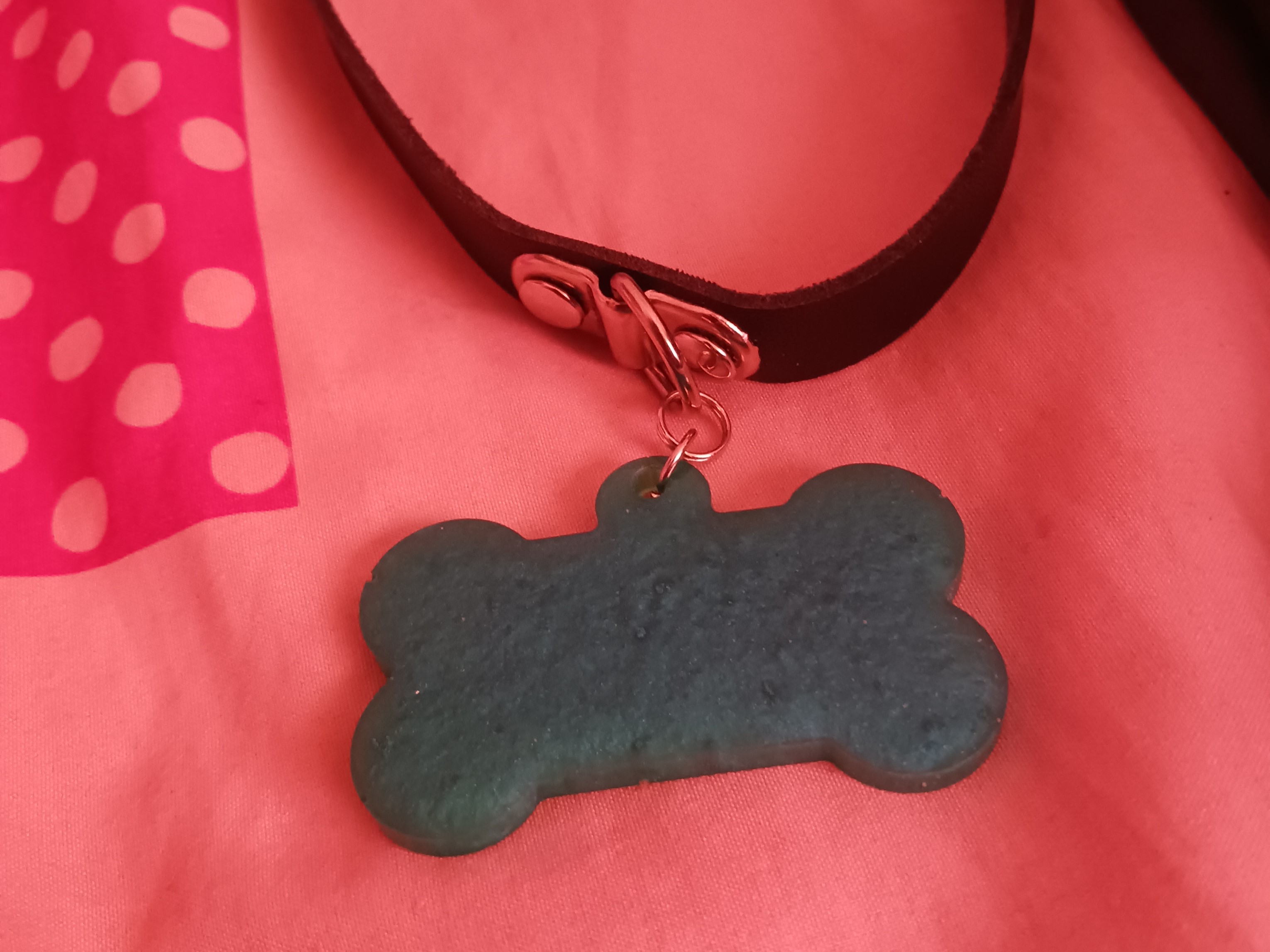 resin dog tag on a choker