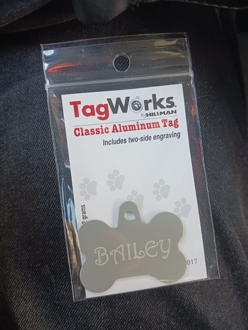 metal dog tag with the name Bailey on it